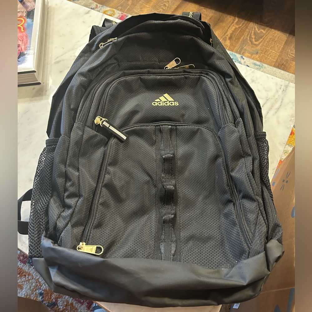 Adidas Black with gold detail backpack